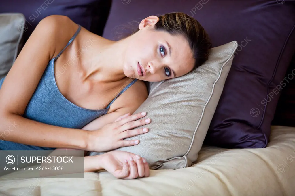 Woman resting on couch.