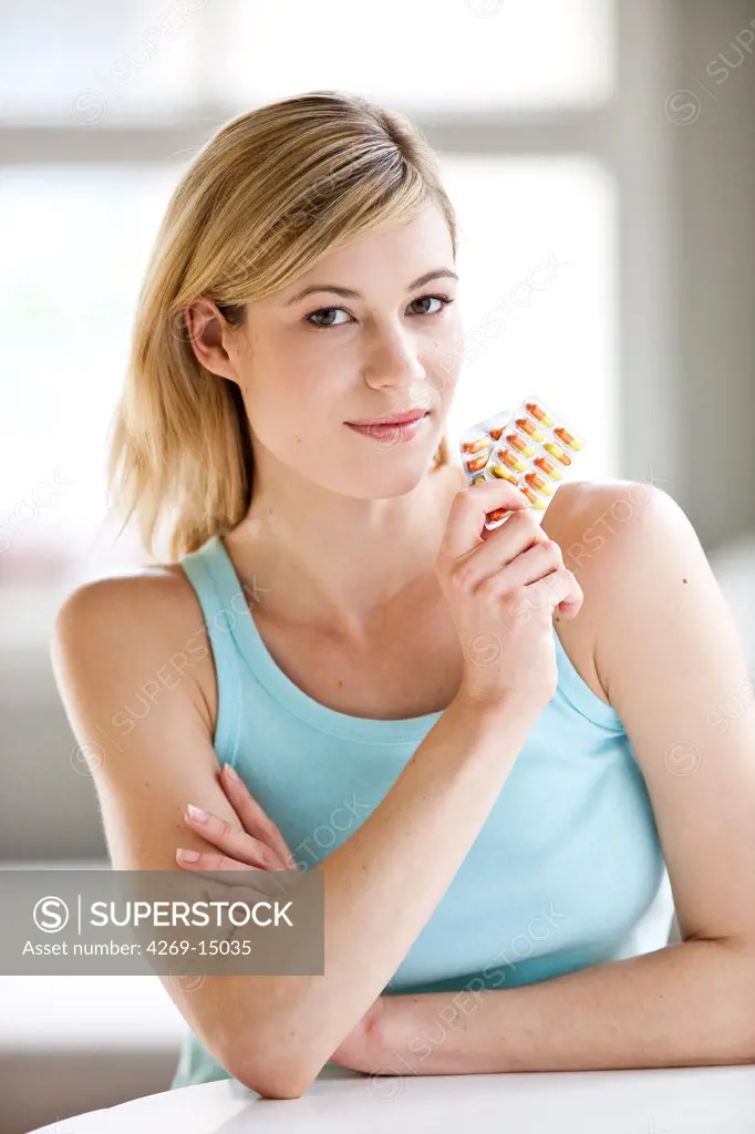 Woman taking medication.
