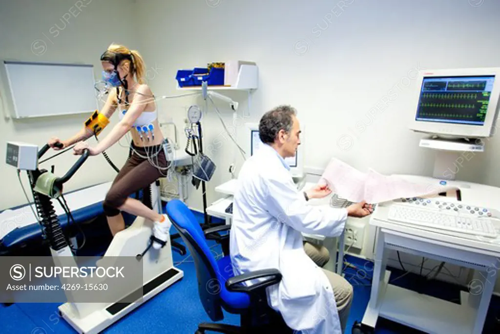 Woman undergoing a stress test and a lung function test. Department of cardiology, Pitié-Salpêtrière hospital, Paris, France.