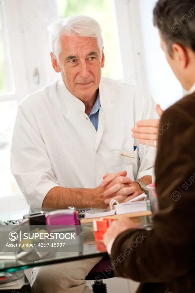 Doctor talking with a patient during medical consultation.