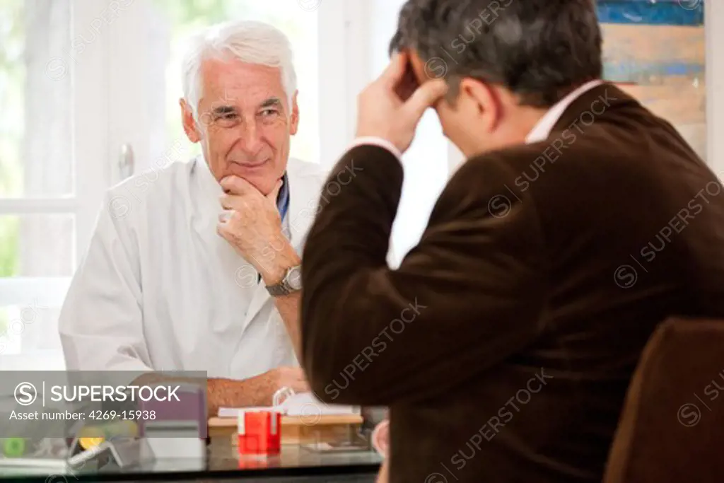 Doctor talking with a patient during medical consultation.