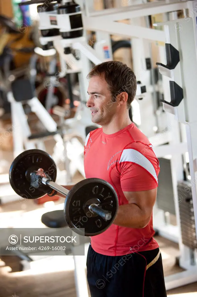 Man exercising with dumbells.