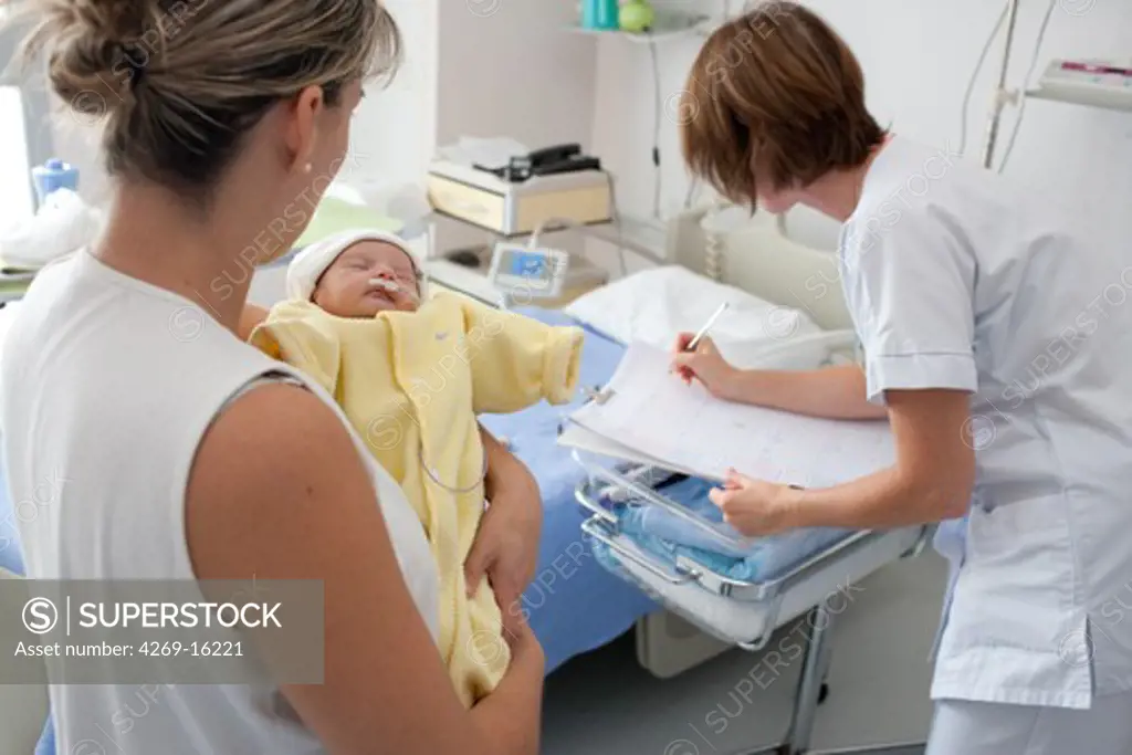 Pediatric auxiliary nurse filling a premature newborn baby medical records. Obstetrics and gynaecology department, Saintonges hospital, Saintes, France.
