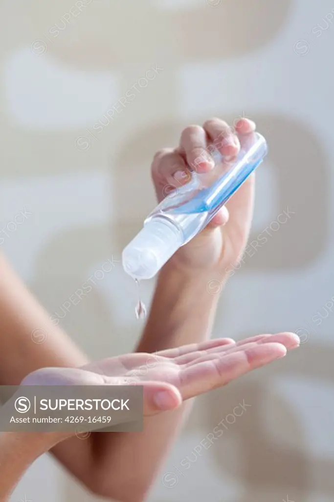 Woman washing her hands with hydroalcoholic gel, as recommended by the Minister of Health in case of viral respiratory diseases, common cold, influenza.
