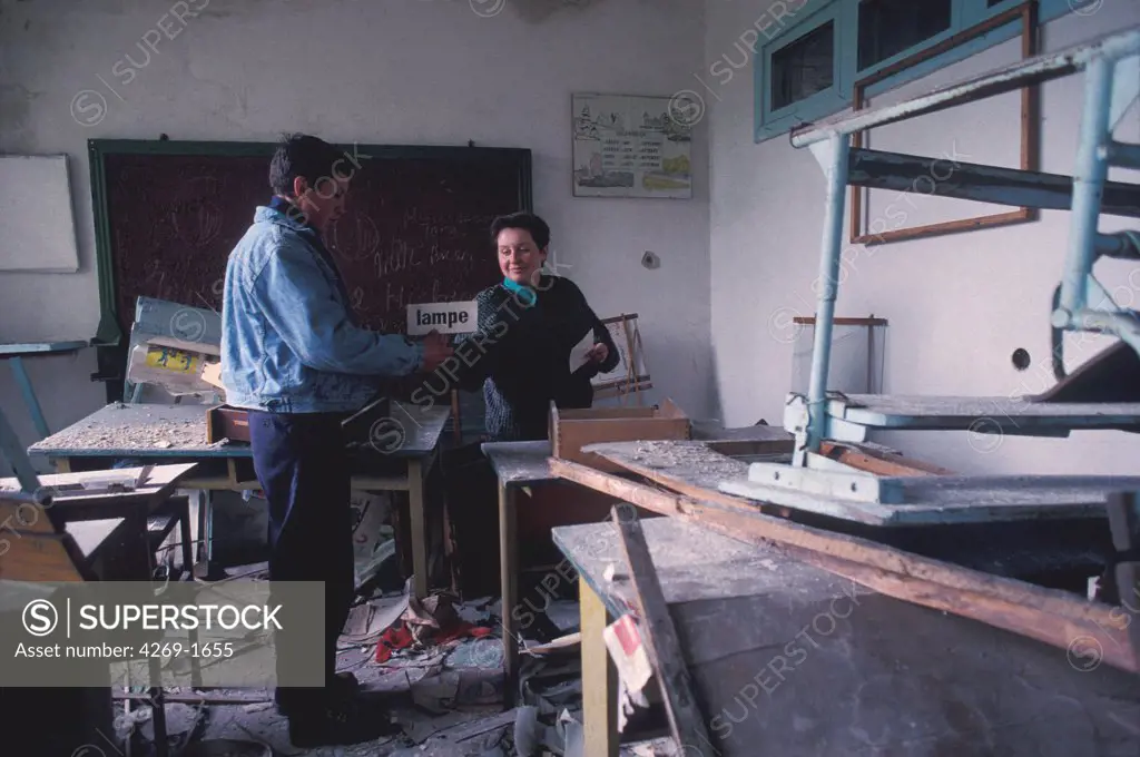 The village de Varovitchi, located within the 30 km area around the nuclear station of Tchernobyl, contaminated by the radioactive fallouts of the nuclear accident of 26 April 1986 and evacuated. Here, Svetlana, the former head of the school and her son, visit the abandonned school.
