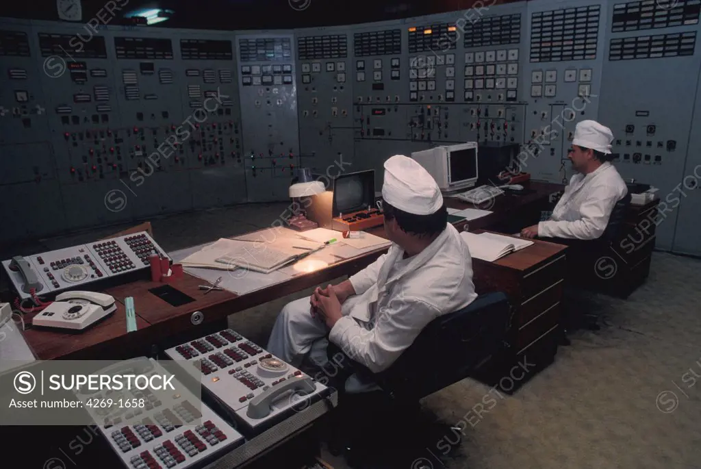 Technicians in a control room of nuclear power station of Tchernobyl.