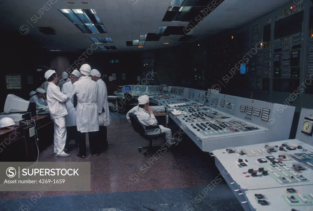 Technicians in a control room of nuclear power station of Tchernobyl.