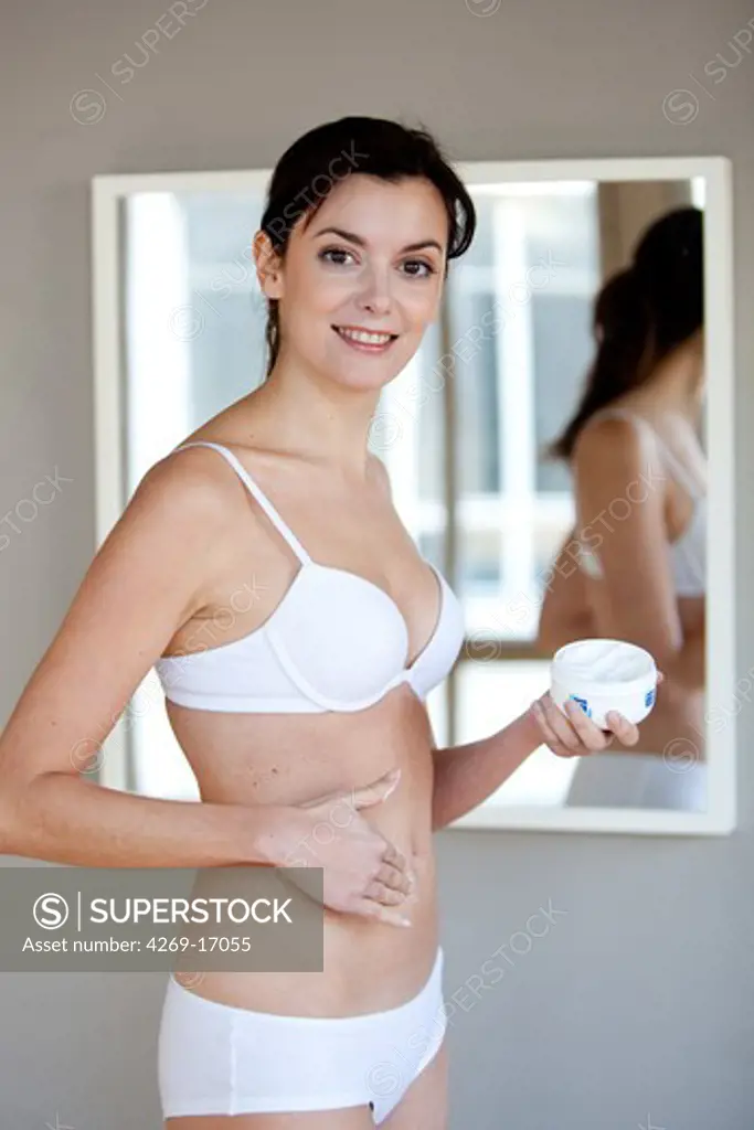 Woman applying cream.