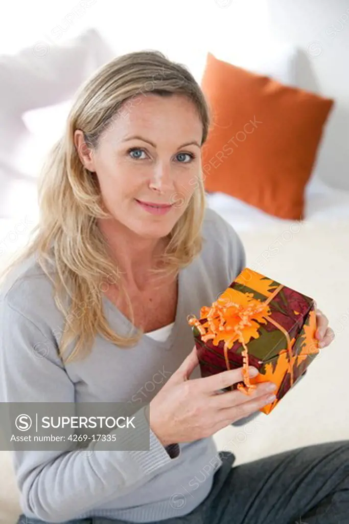 Woman holding a gift.