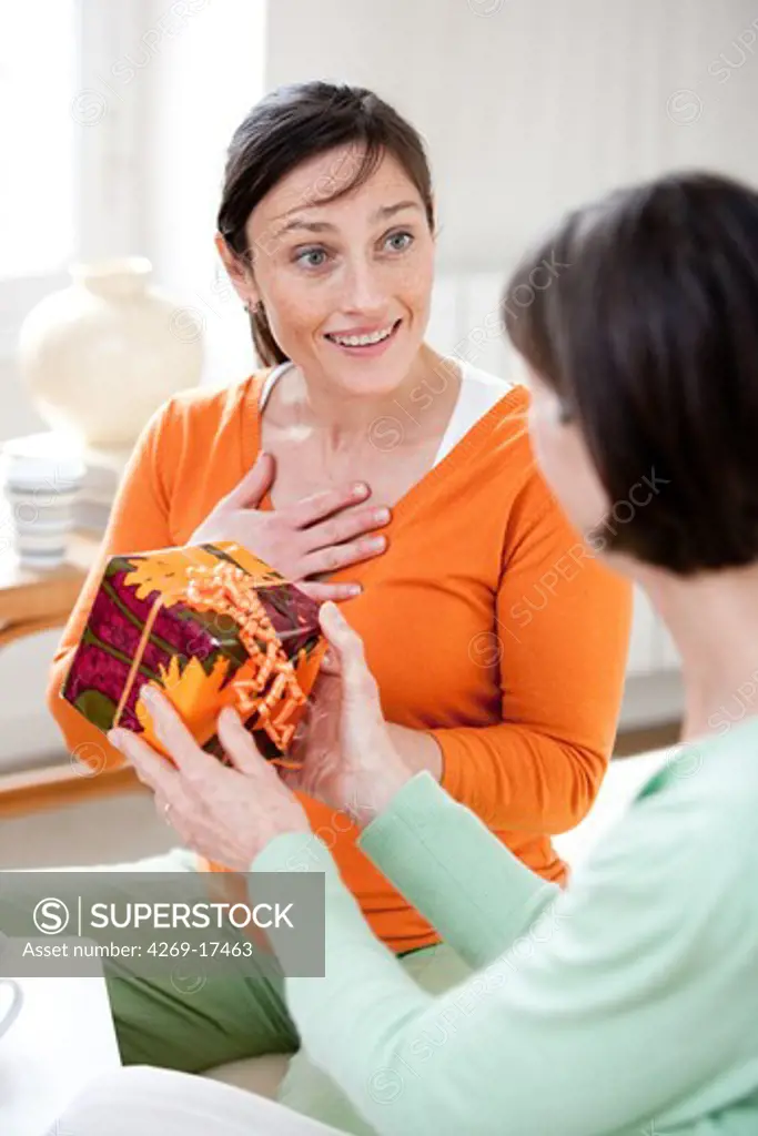 Woman receiving a gift.