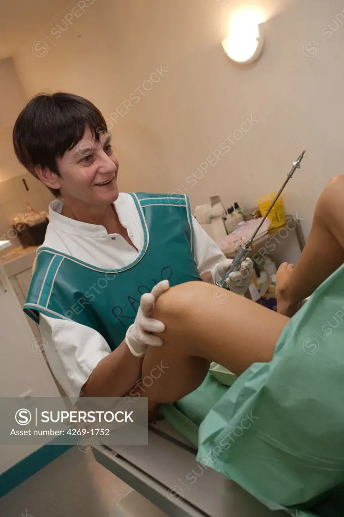 The hysterosalpingography or hysterography is an X-ray of the uterus and the fallopian tubes. Here, the doctor injects a iodine contrast medium, while explaining and conforting the patient about the examination.