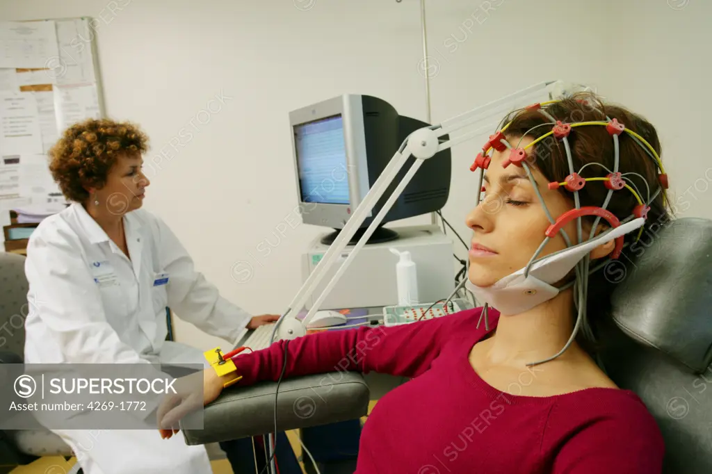 Patient undergoing an electroencephalogram (EEG). The results are recorded directly on a computer.