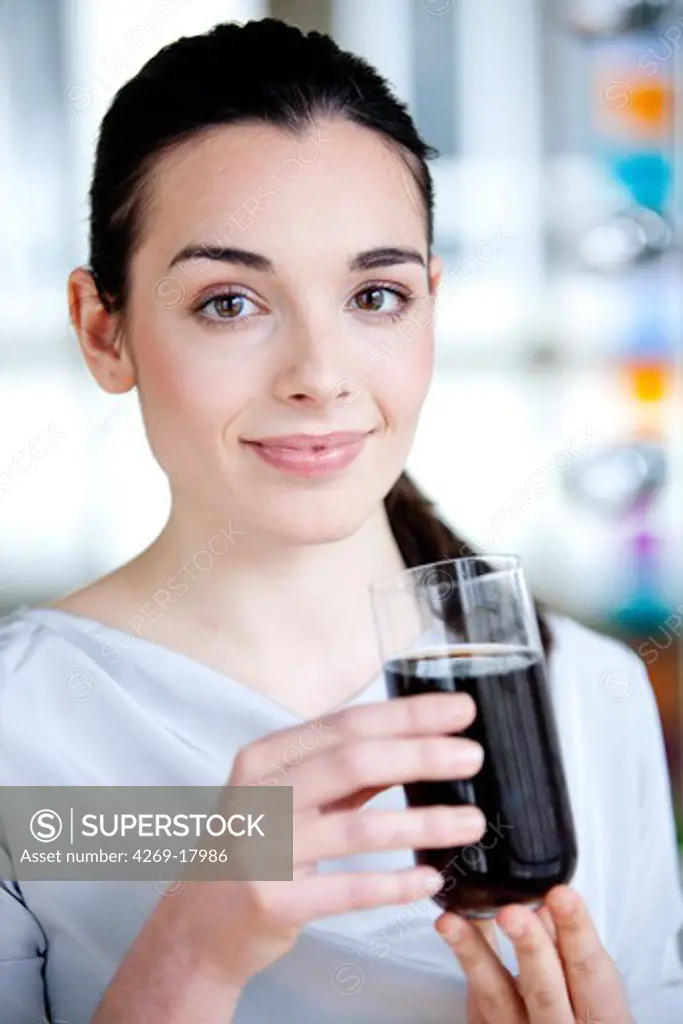 Woman drinking a soda.
