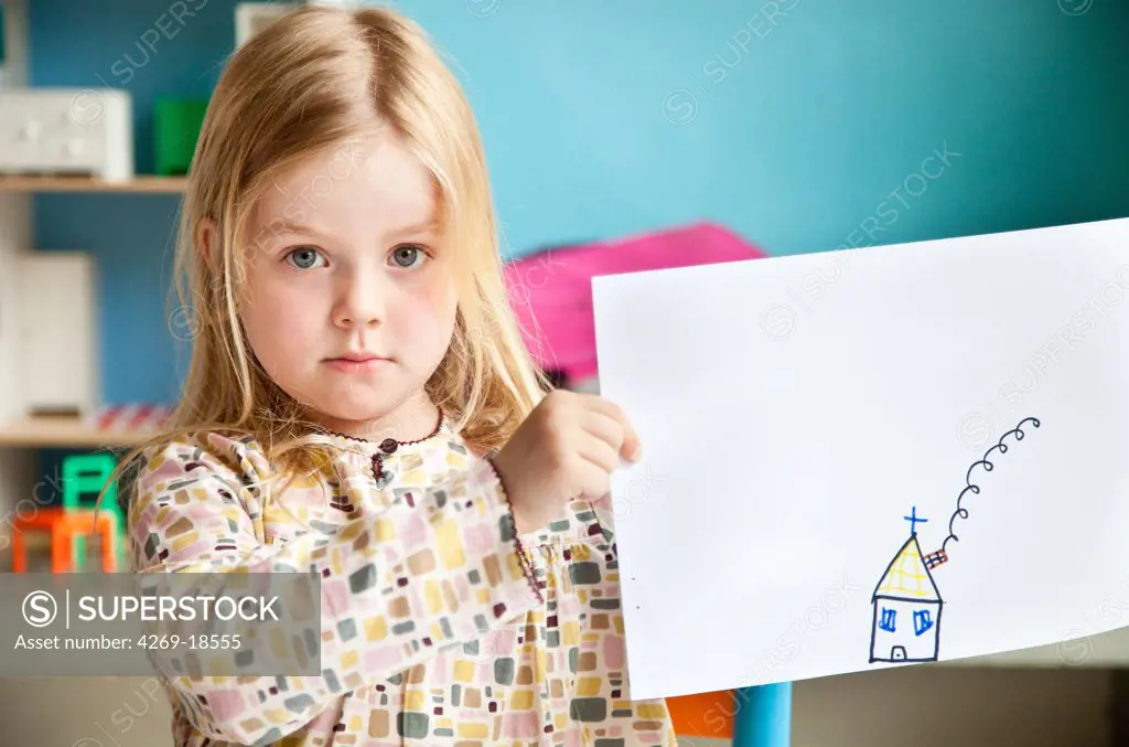 5 years old girl showing her drawing.