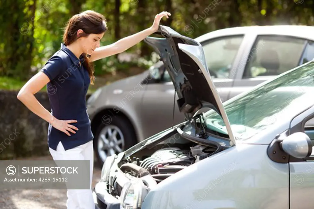 Woman with a car trouble.