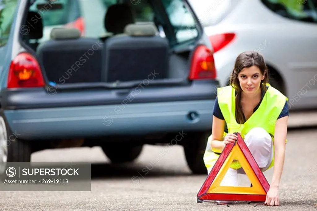 Road safety triangle and safety vest.