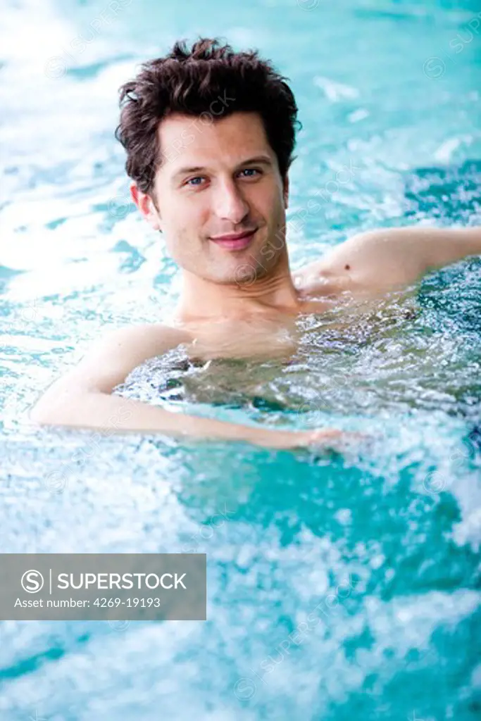 Man in a spa pool.