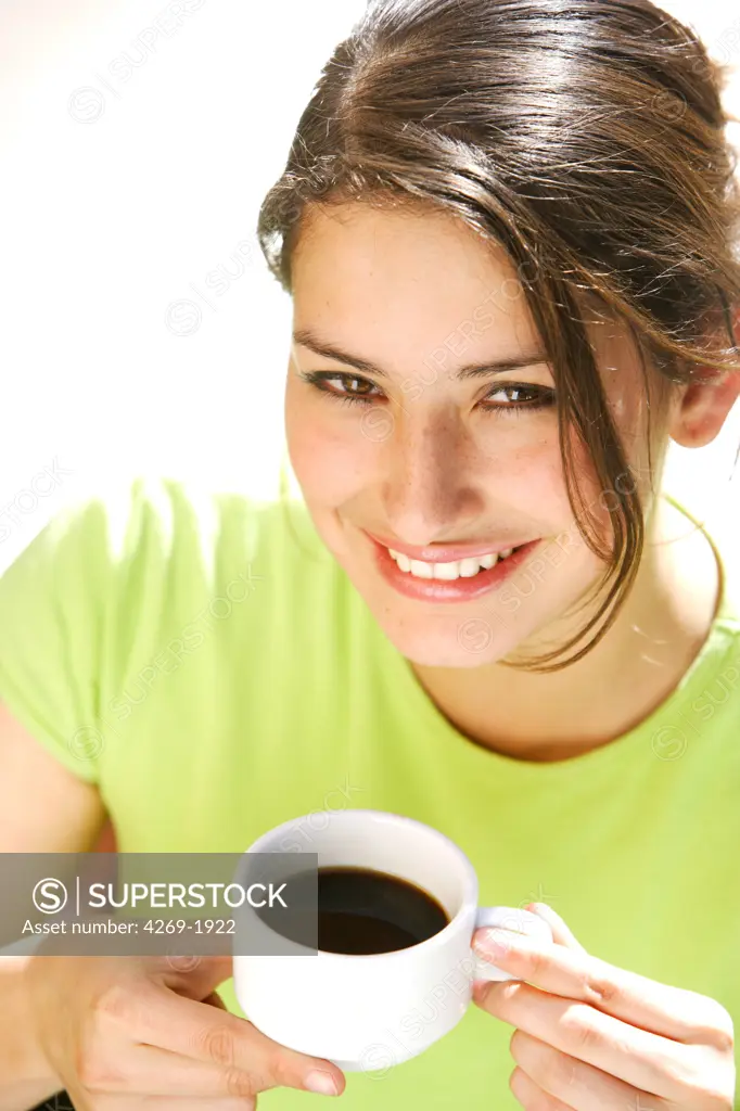 Woman drinking coffe.