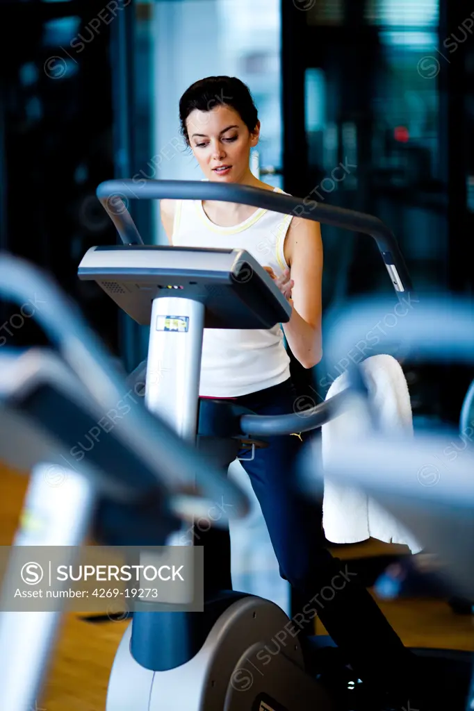 Woman exercising on treadmill at the gym.