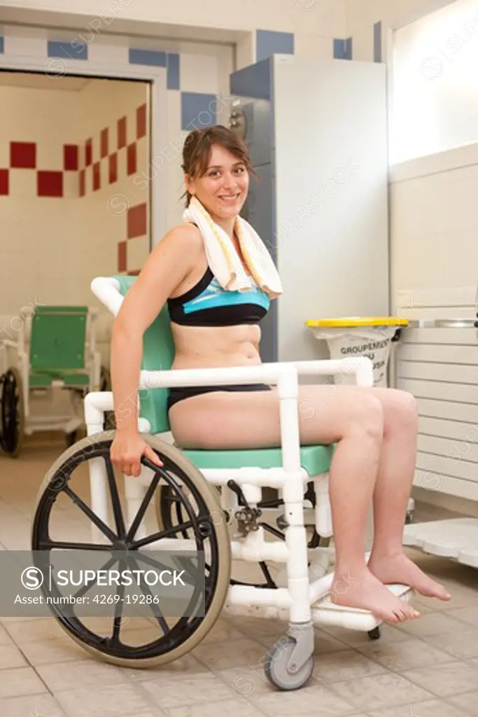 Disabled person preparing for aquatic rehabilitation. Department of Physical Medicine and Rehabilitation, Limoges hospital, France.