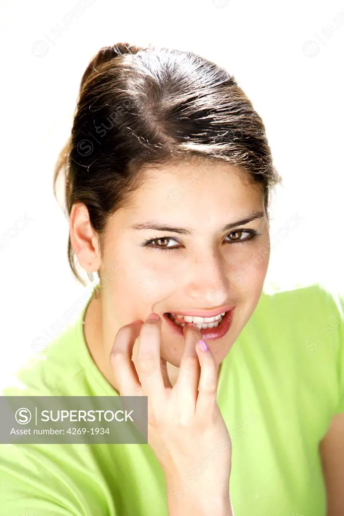 Woman bitting her nails.