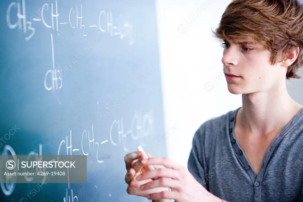 Teenage boy in a classroom.