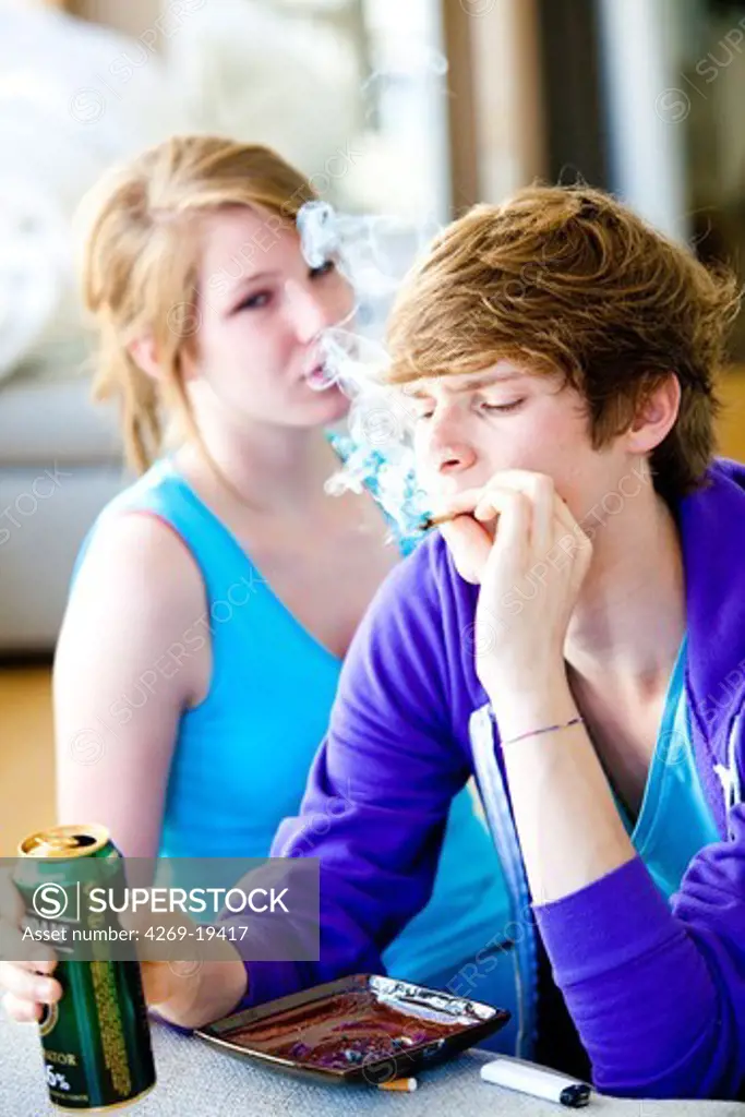 Teenagers smoking marijuana or hashish cigarette.