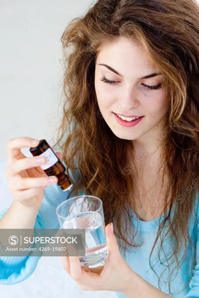 Woman taking vitamin D.