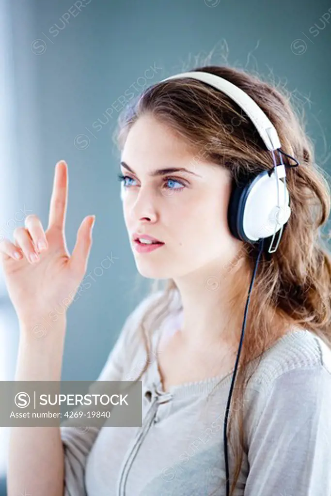 Woman undergoing pure-tone audiometry test.
