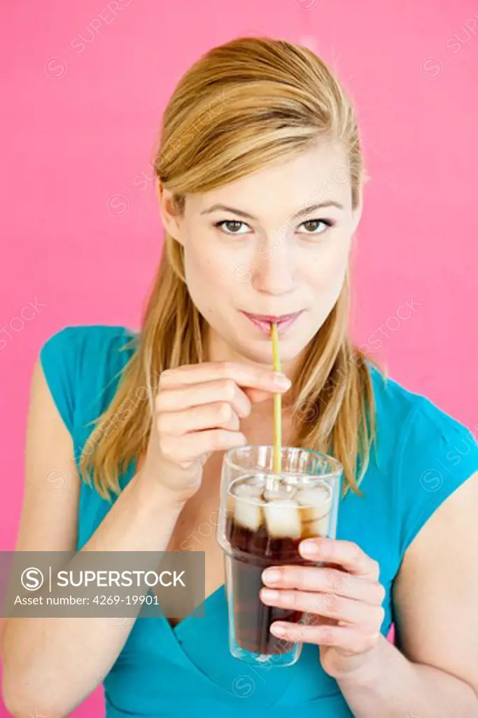 Woman drinking a cold drink.