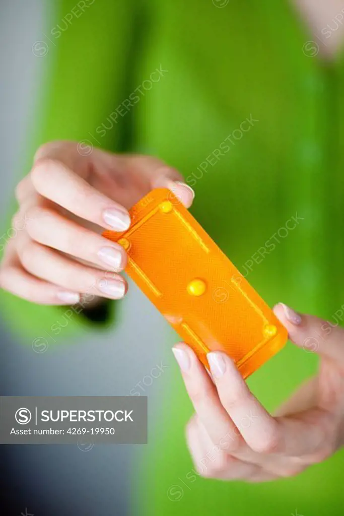 Woman holding the Norlevo morning-after pill (emergency contraceptive pill).
