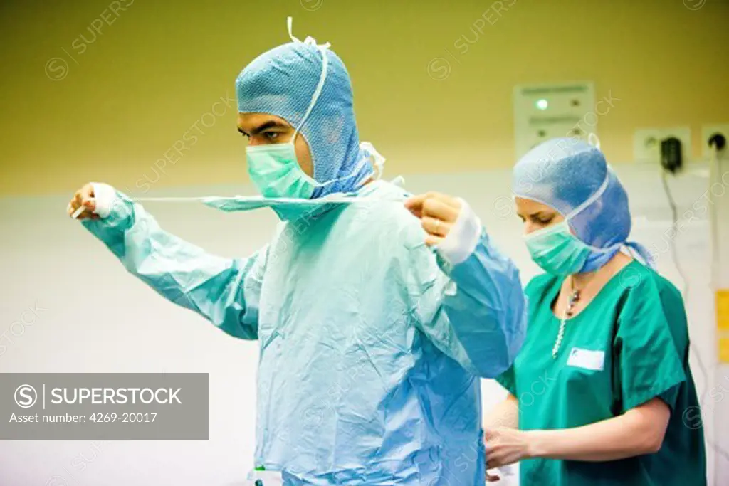 Surgical team getting dressed before surgery.
