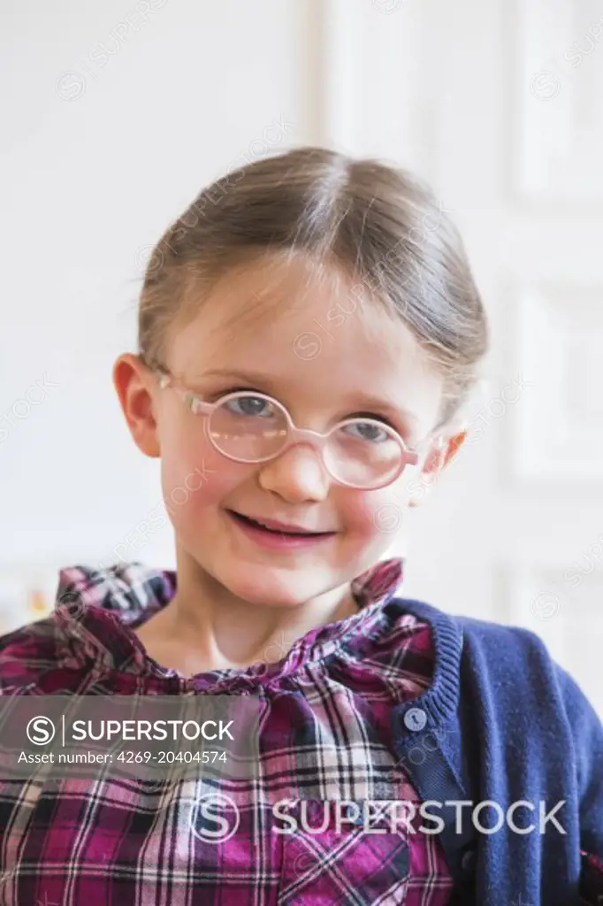 5 year-old girl wearing glasses.