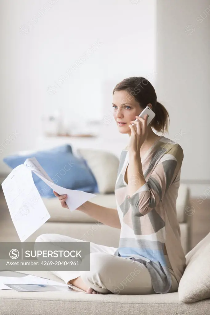Woman reading medical analysis results.