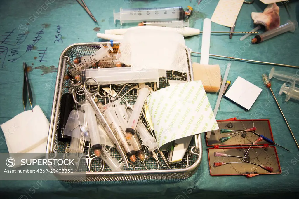 Equipment tray of surgical instruments including waste from previous surgery