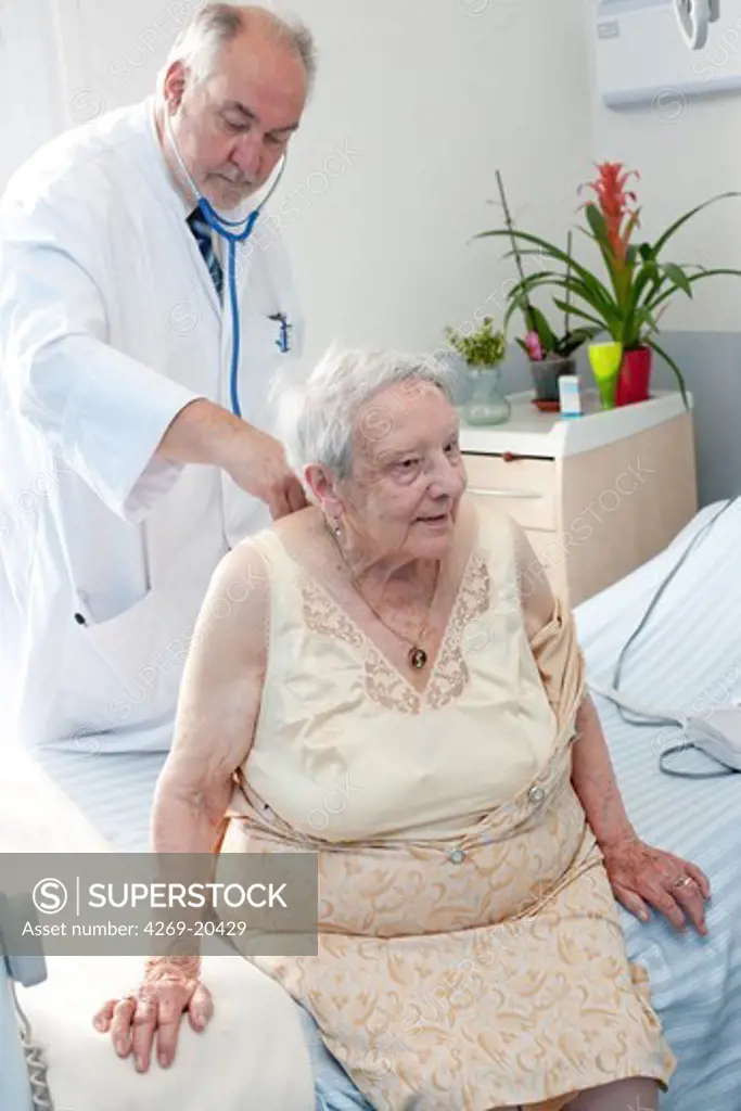 Elderly patient in consultation with a gerontologist. Residential home for dependent elderly person, Limoges, France.