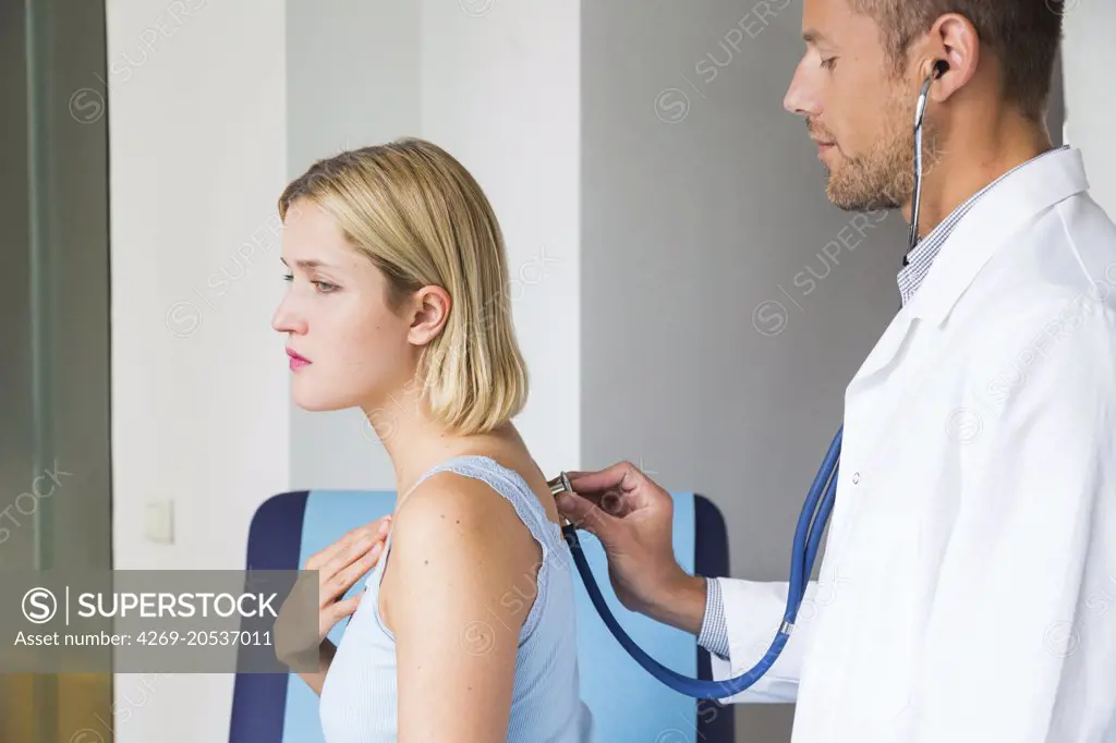 Doctor examining a patient with a stethoscope.