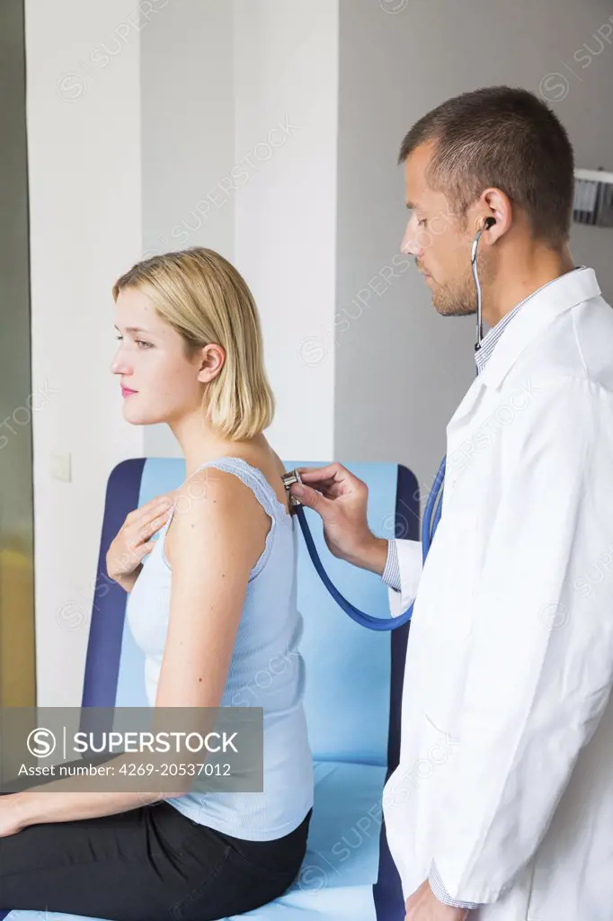 Doctor examining a patient with a stethoscope.