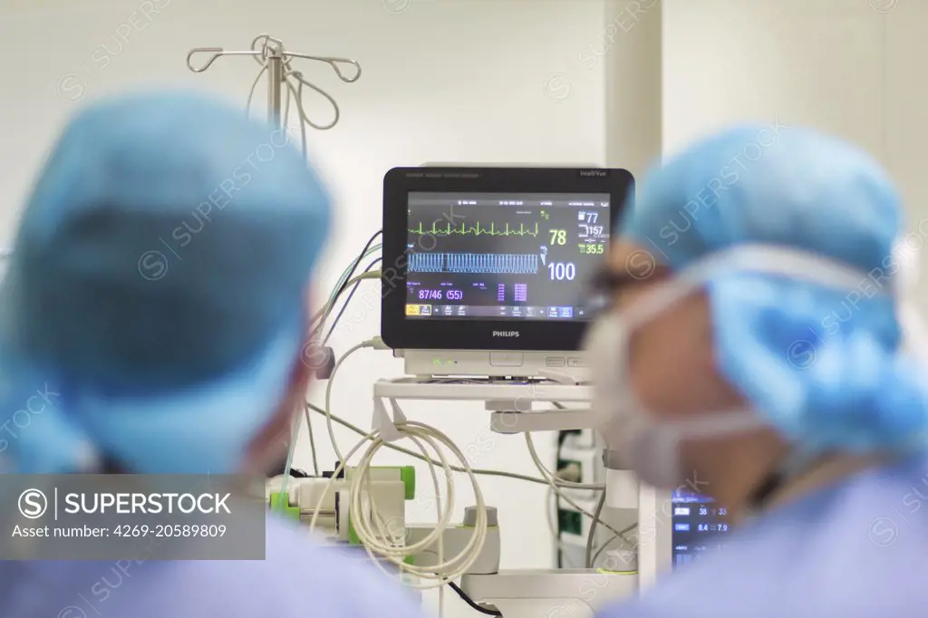 Surgical monitors being used to track the vital signs of a patient during an operation.