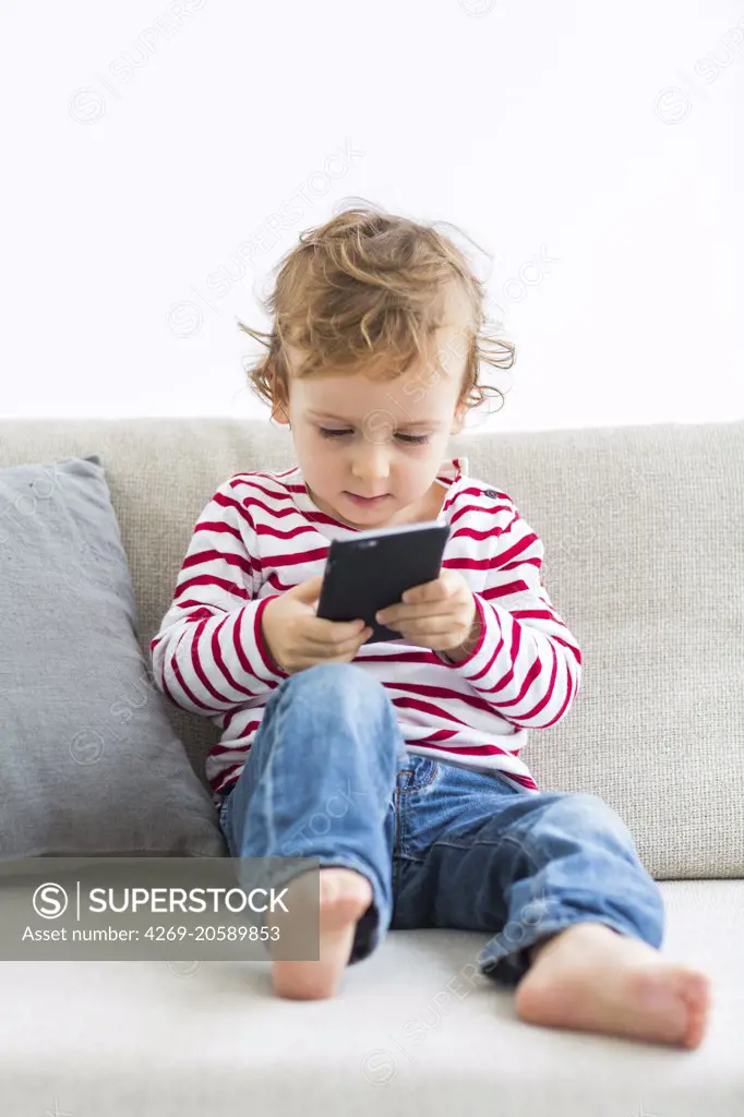 2 year-old boy with cell phone.