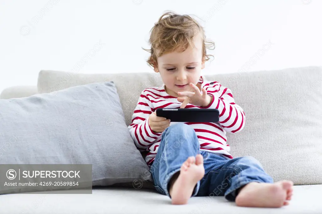 2 year-old boy with cell phone.