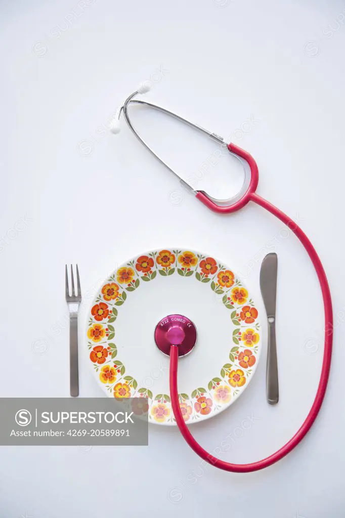Stethoscope on a plate. Conceptual image about the benefits of a balanced diet on health.