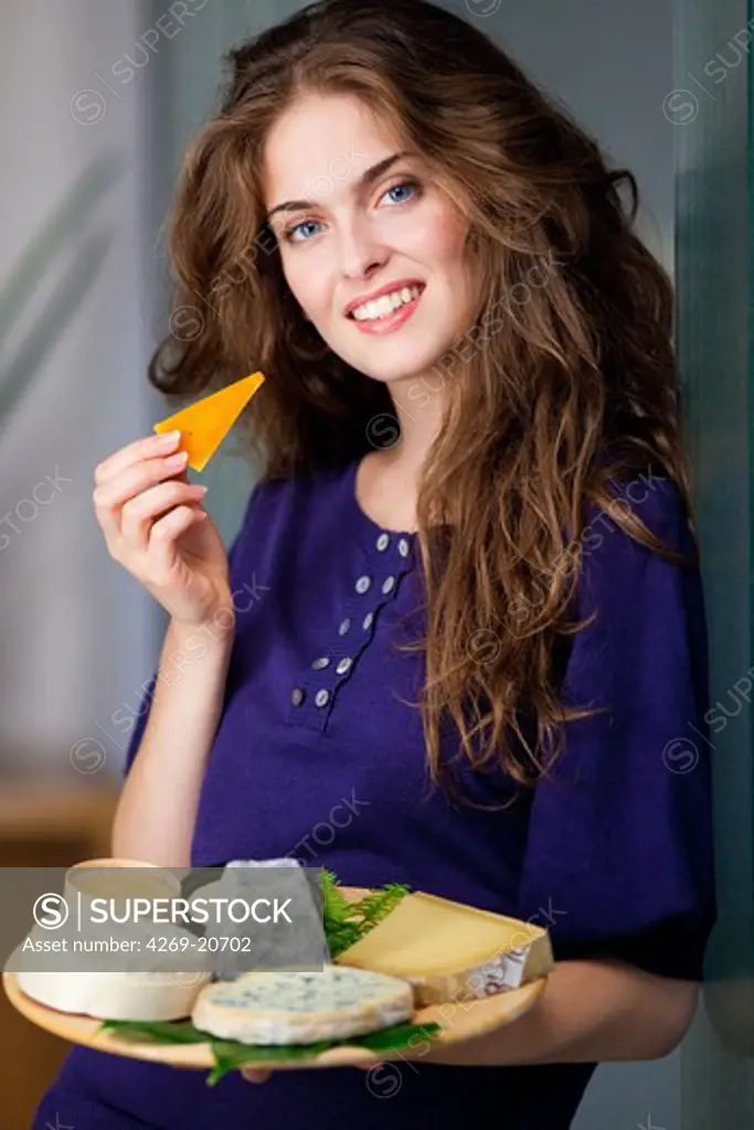 Woman eating cheese.