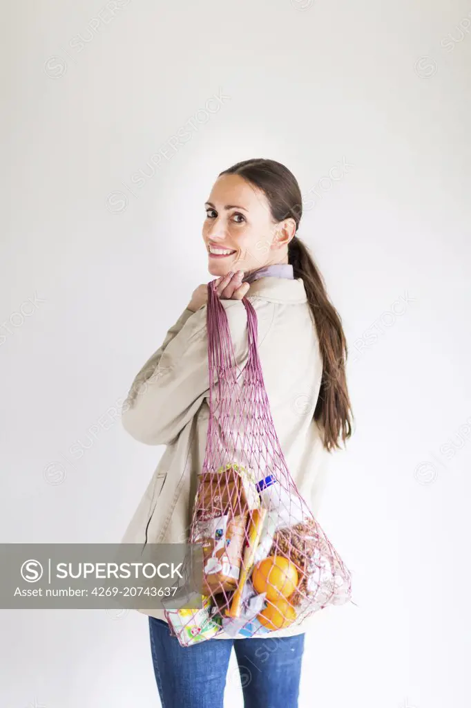 Woman holding net shopping.