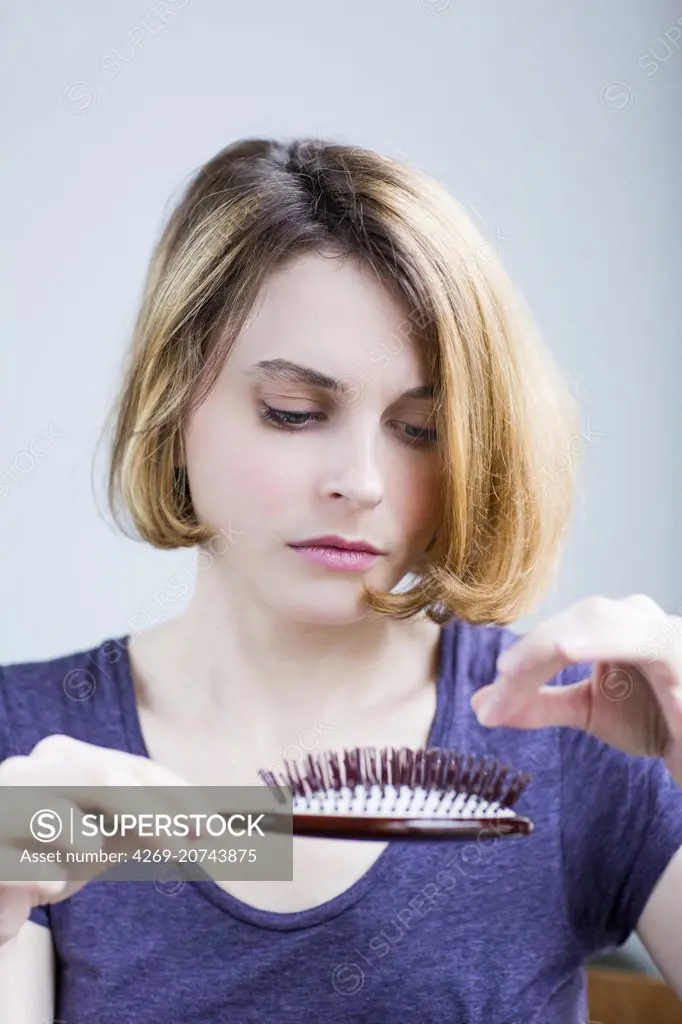 Woman brushing her hair.
