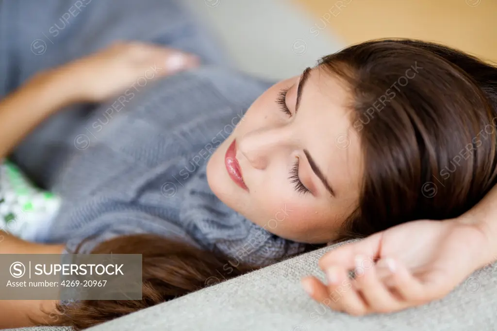 Woman relaxing on couch.