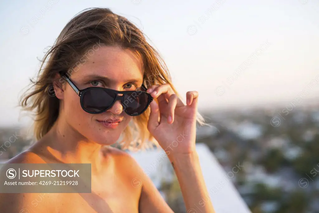 Woman wearing sunglasses.