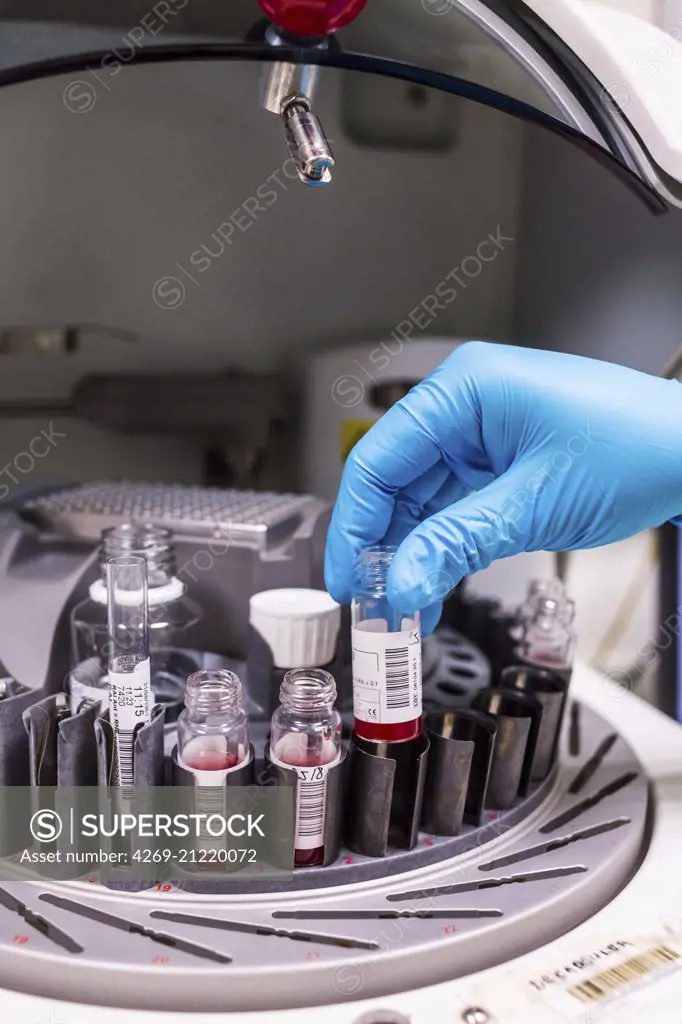 Blood samples in vials on a centrifuge machine.