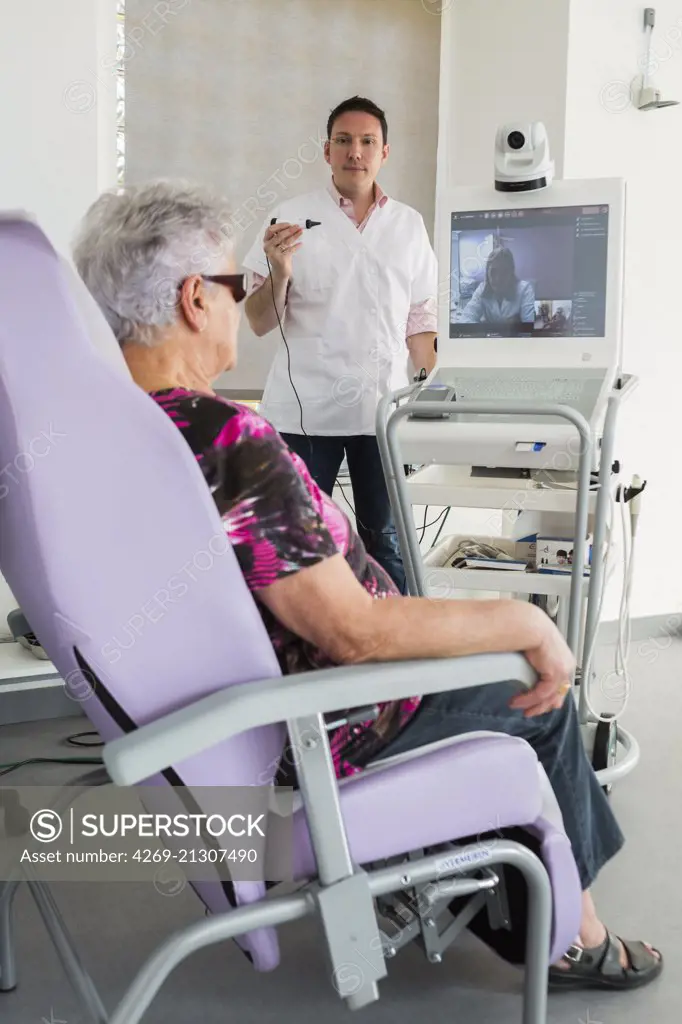 Medical consultation in a telemedicine practice in rural area, Patient assisted by a nurse for remote consultation with the general practitioner, Medical Center Oberbruck (Haut-Rhin), France.