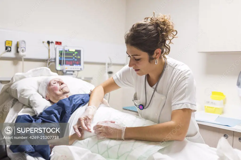 Elderly patient with a nurse at the Emergency department of a private hospital.
